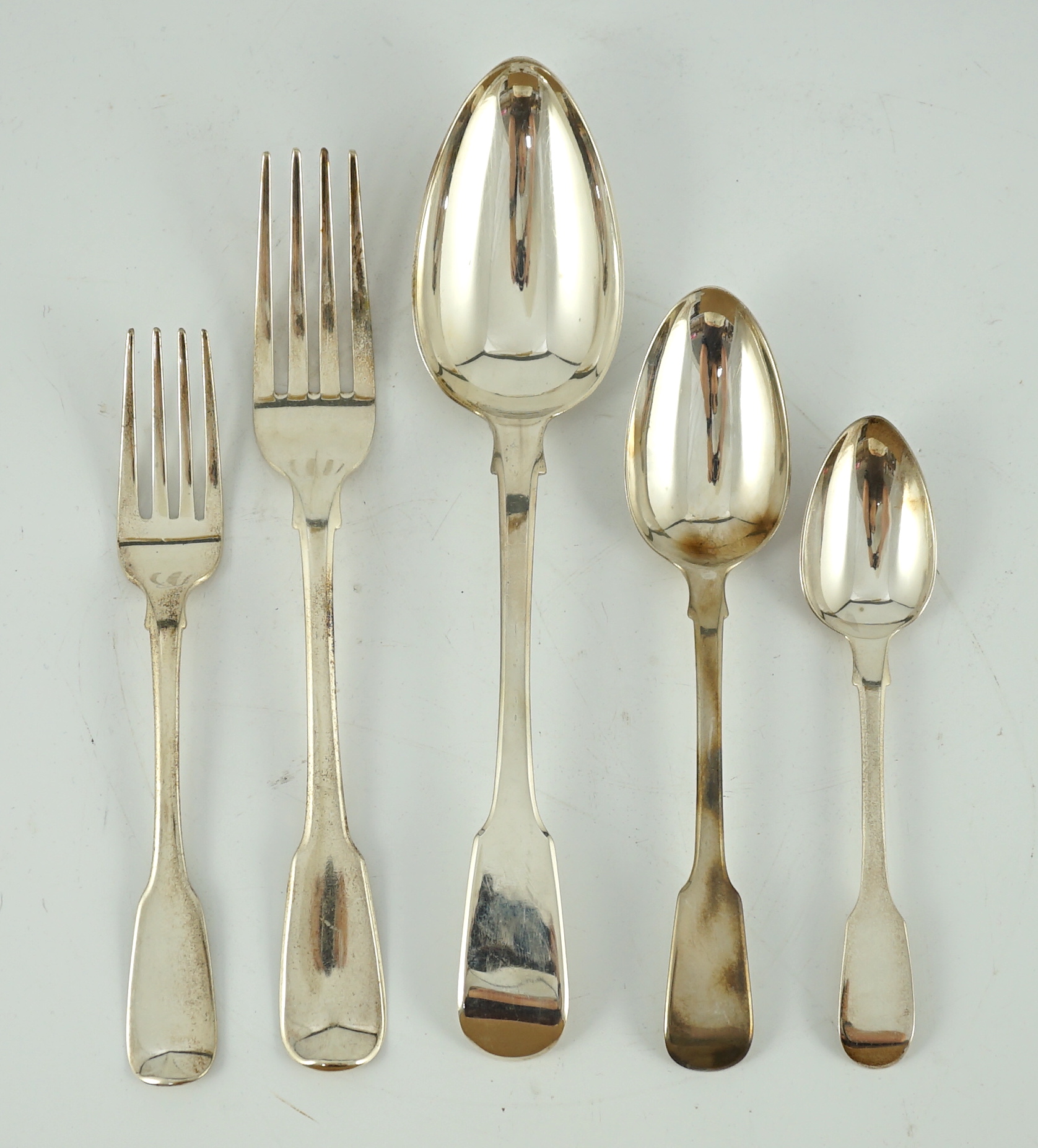 A matched canteen of early 19th century silver fiddle pattern flatware for twelve